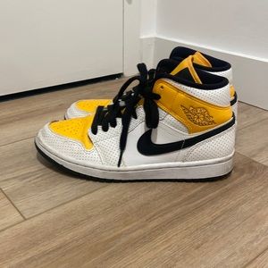 Women’s black and yellow Nike Air Jordans sneakers, size 9